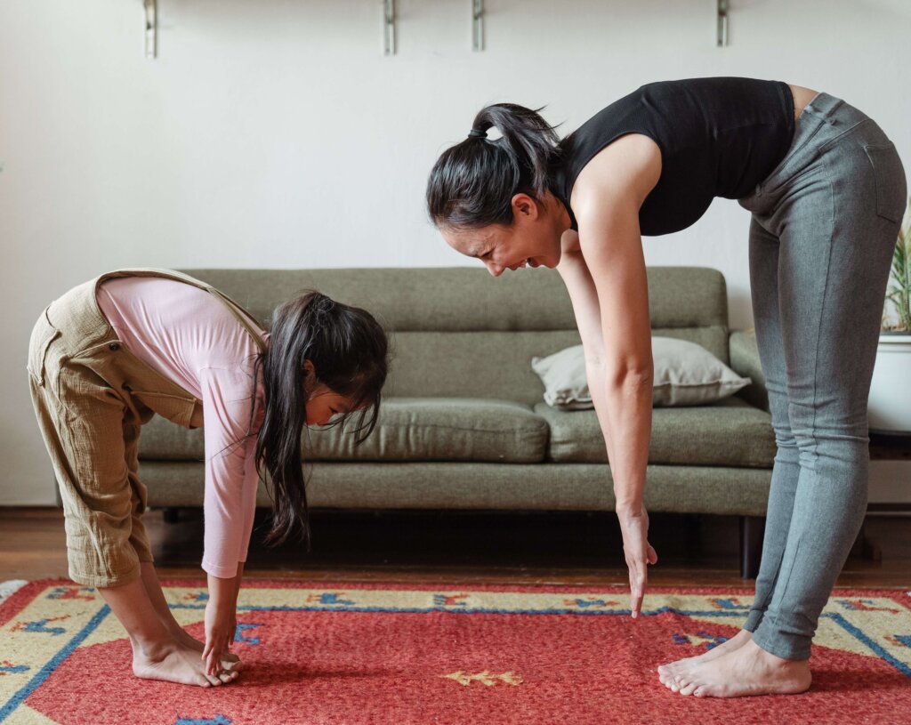 mother and daughter exercising together