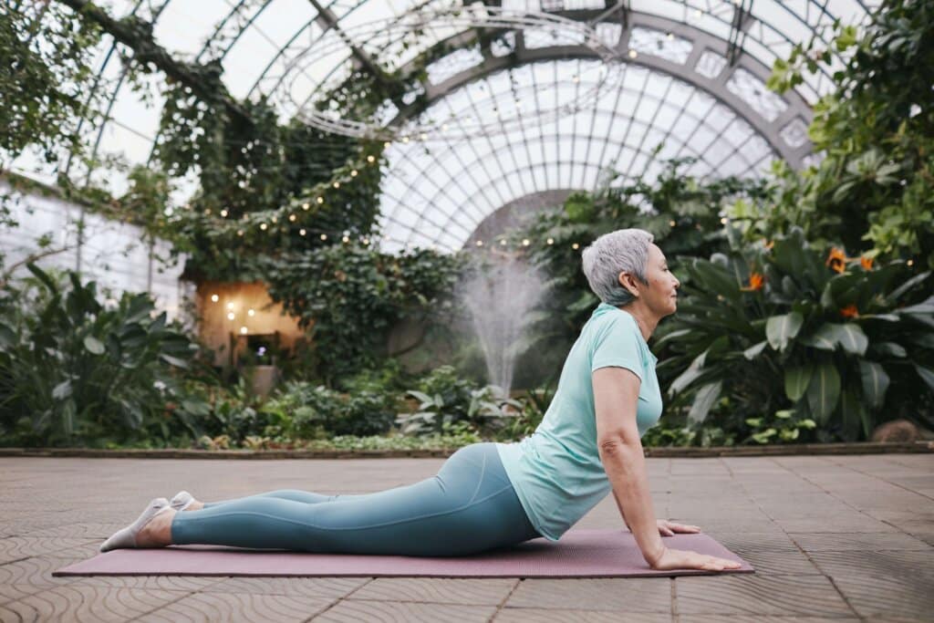 an older woman doing the cobra stretch