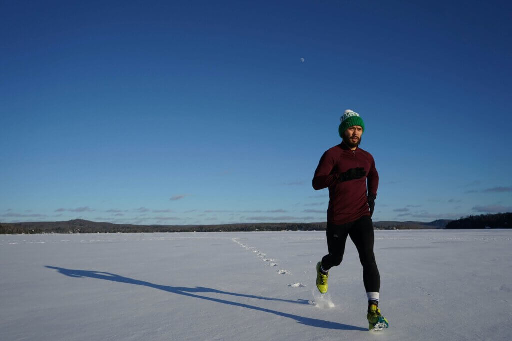 Wear the right layers to stay warm and dry on a winter run.