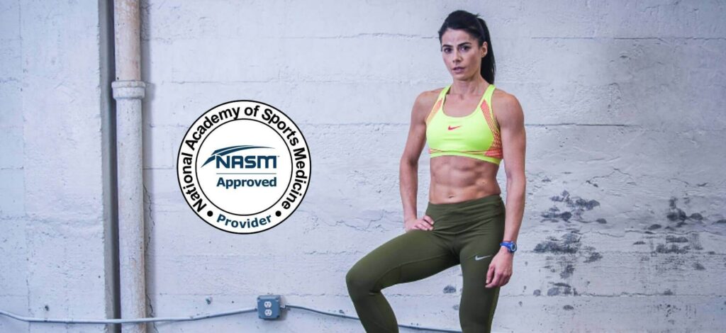 Who good personal trainer who is NASM certified. She is standing in a gym with her workout gear on, looking fit.